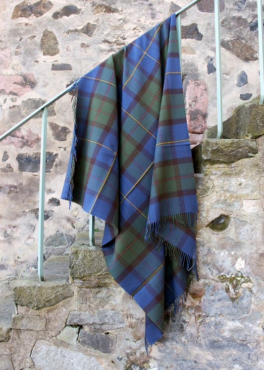 Lambswool tartan blanket in the blues, greens and browns of the Macleod of Harris tartan. Made in the Scottish Borders. Scottish Textiles Showcase.