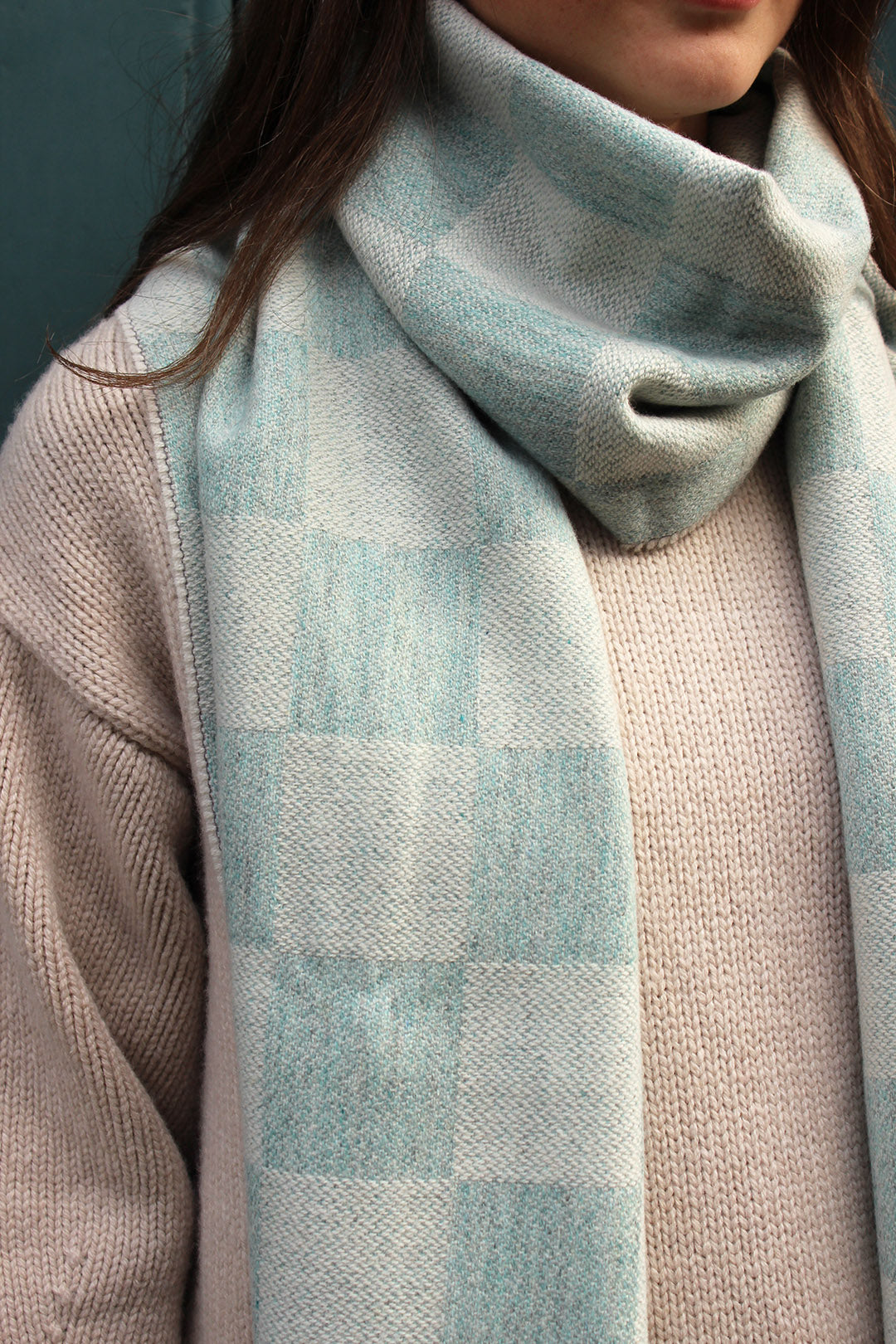 checked scarf in a lovely pale moonstone blue is woven in merino wool