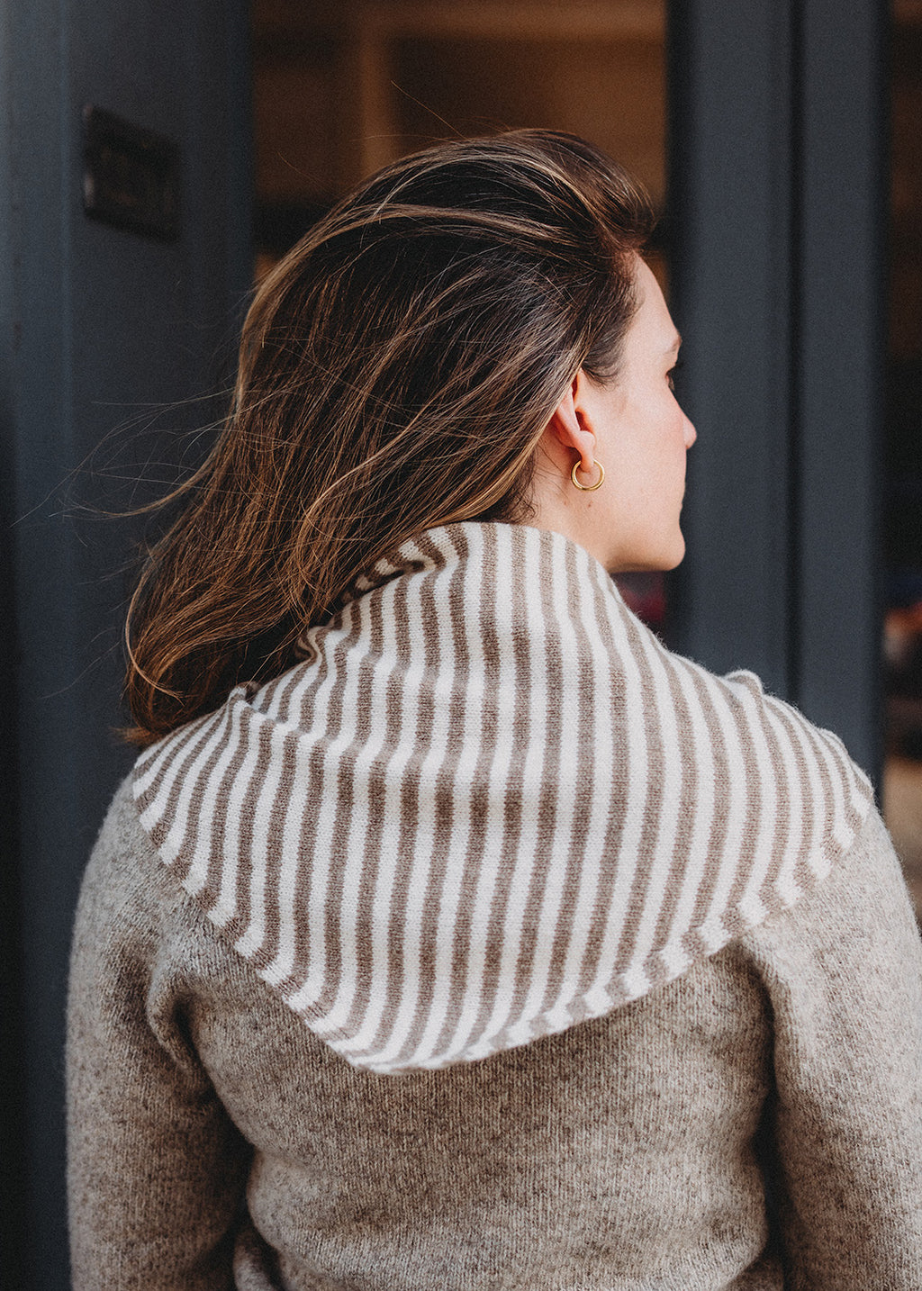 Triangle scarf knitted in soft lambswool in an oat and off-white stripe.
