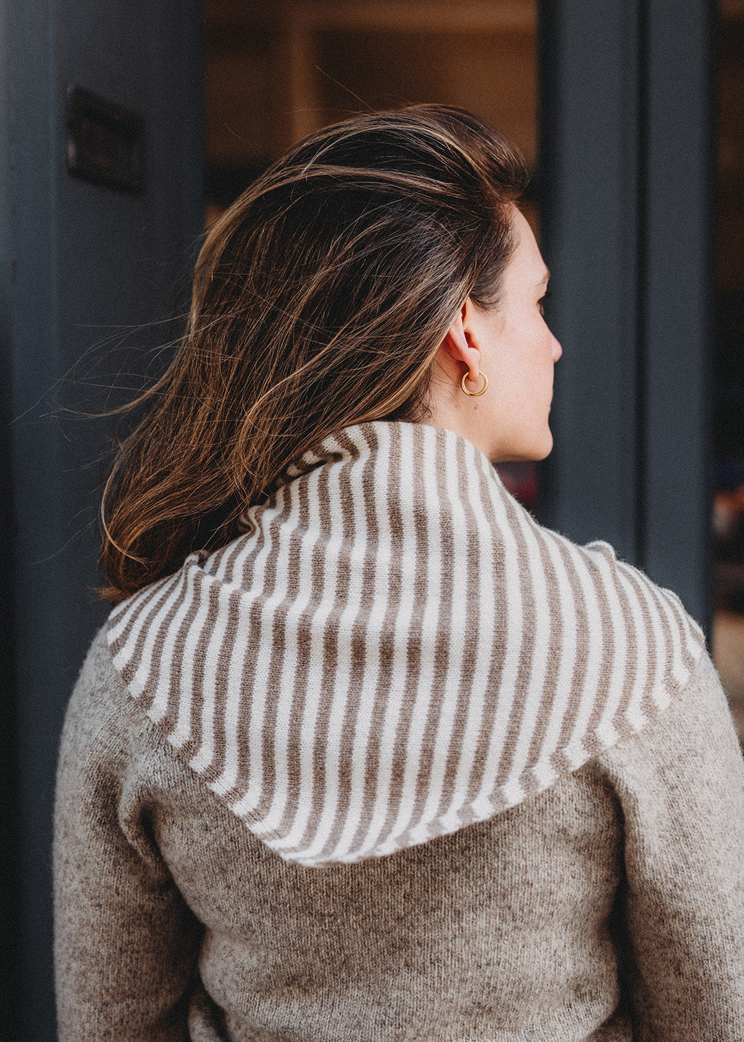 Triangle scarf knitted in soft lambswool in an oat and off-white stripe.
