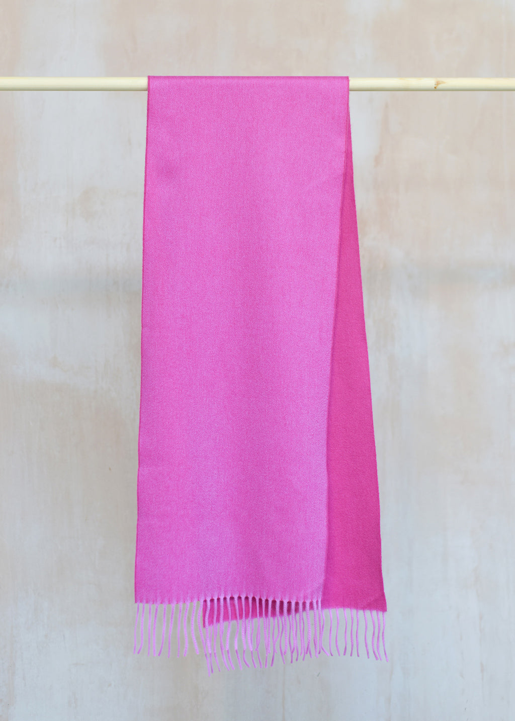 Beautifully soft, reversible cashmere scarf in two shades of bubblegum pink.