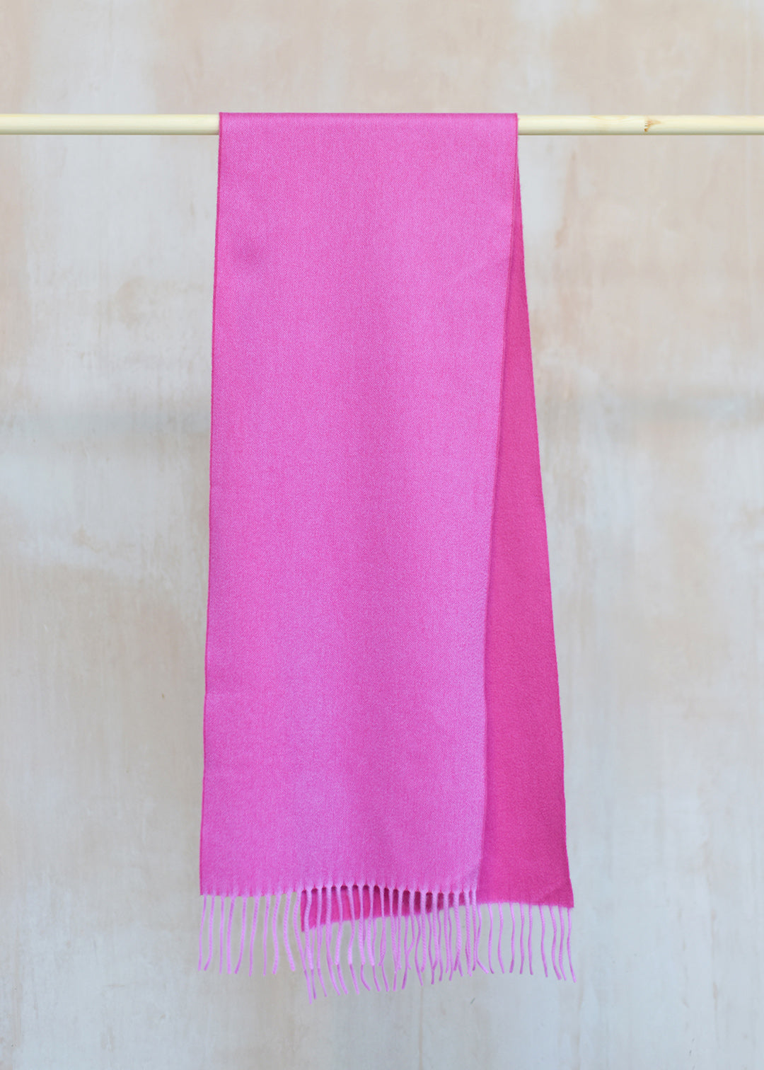 Beautifully soft, reversible cashmere scarf in two shades of bubblegum pink.