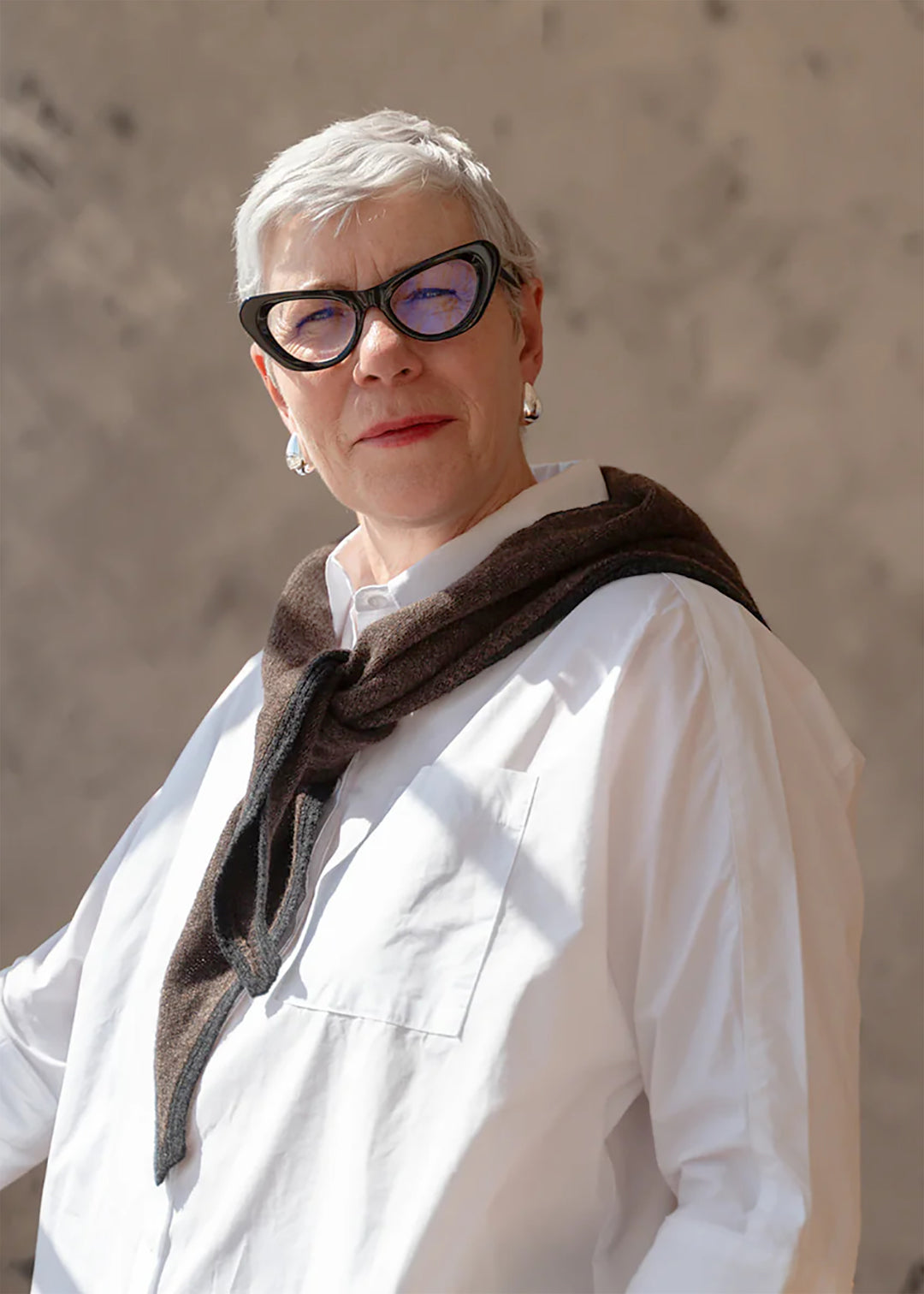 Knitted lambswool triangle scarf in dark brown with a charcoal trim.