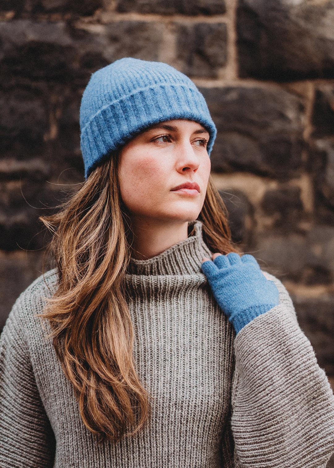 Ladies' lambswool fingerless gloves and matching hat in mid blue.