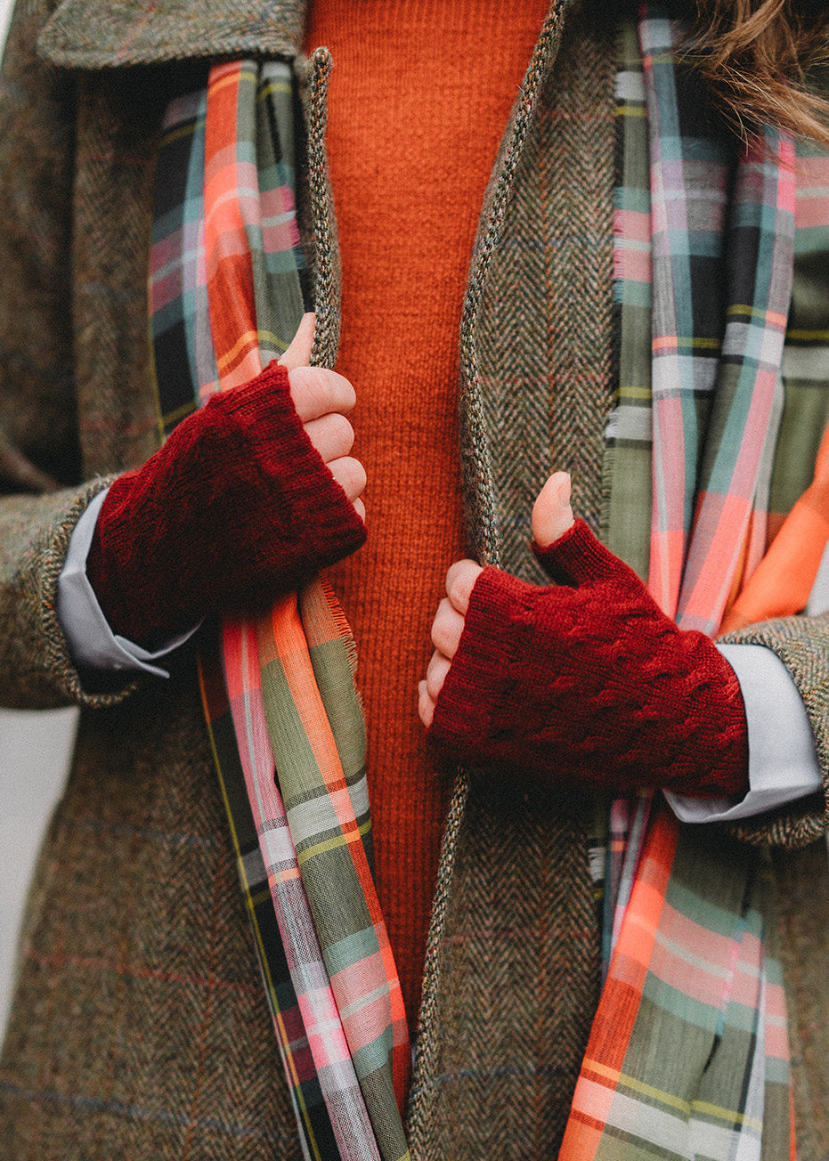 Cherry red, cable knit cashmere wristwarmers.