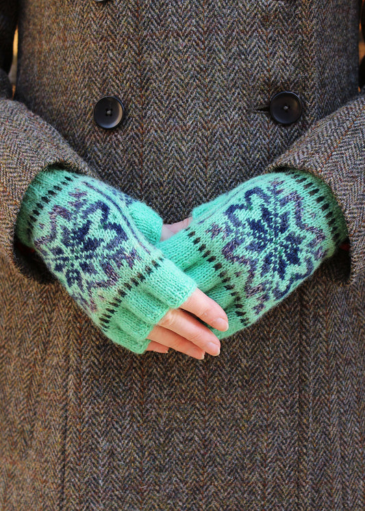 Hand knitted gloves in mint green with Fair Isle pattern.