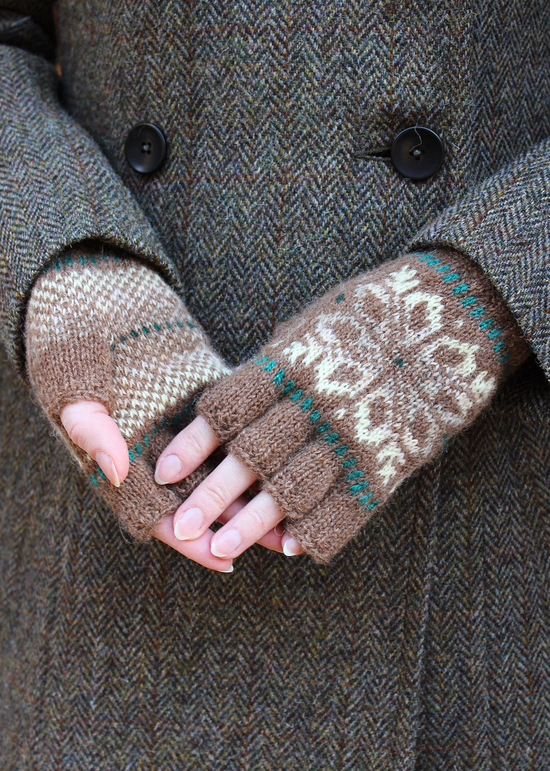 Hand knitted fingerless gloves in malt brown with Fair Isle pattern.