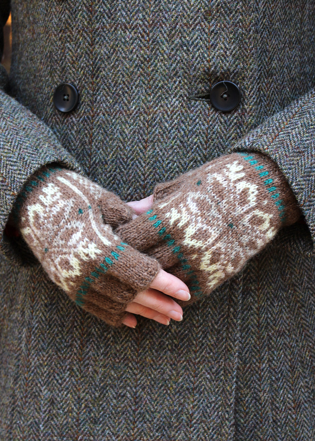 Hand knitted fingerless gloves in malt brown with Fair Isle pattern.