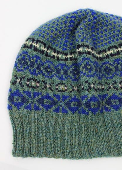 Hand knitted Fair Isle beanie hat in sea green with royal blue details.