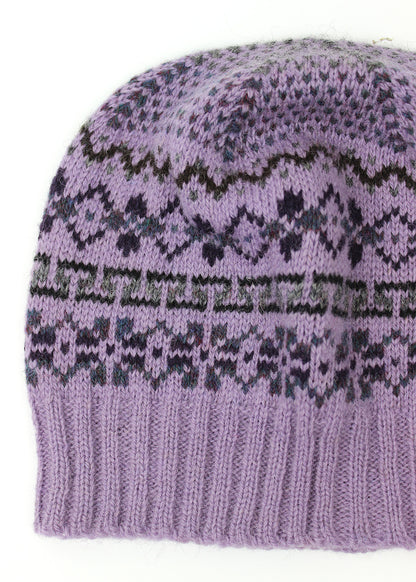 Hand knitted Fair Isle beanie hat in lilac with grey and dark purple details.