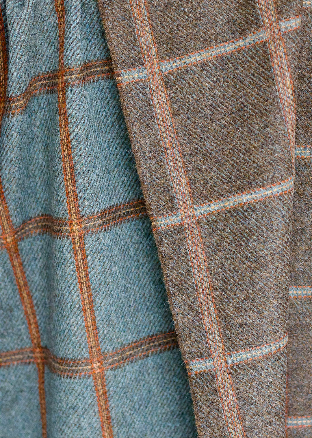 Reversible, checked wool throw in sea blue-green and brown.