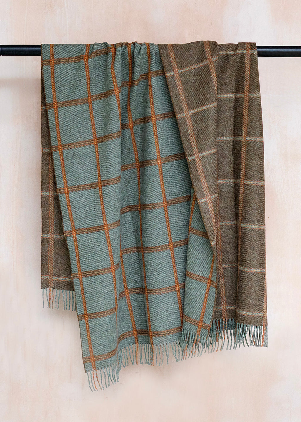 Reversible, checked wool throw in sea blue-green and brown.