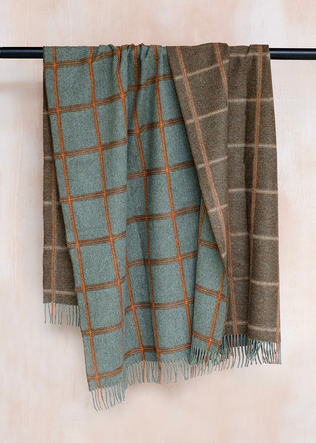 Reversible, checked wool throw in sea blue-green and brown.
