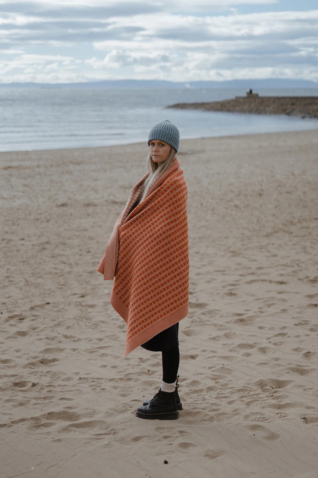 Jacquard knit blanket in furnace Inspired by timeless weave structures and knitted in Ayrshire in sumptuously soft lambswool by Hilary Jane Keyes.