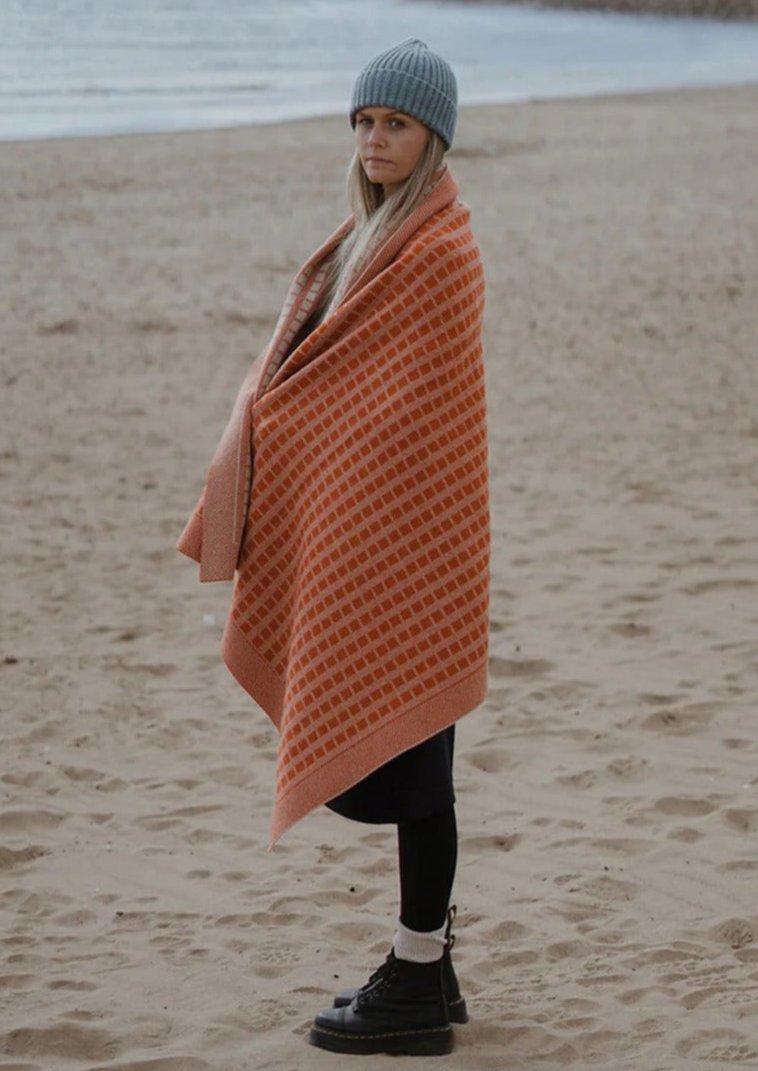 Jacquard knit blanket in furnace Inspired by timeless weave structures and knitted in Ayrshire in sumptuously soft lambswool by Hilary Jane Keyes.