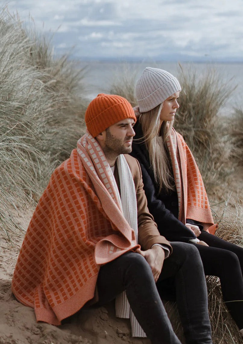 Jacquard knit blanket in furnace Inspired by timeless weave structures and knitted in Ayrshire in sumptuously soft lambswool by Hilary Jane Keyes. 