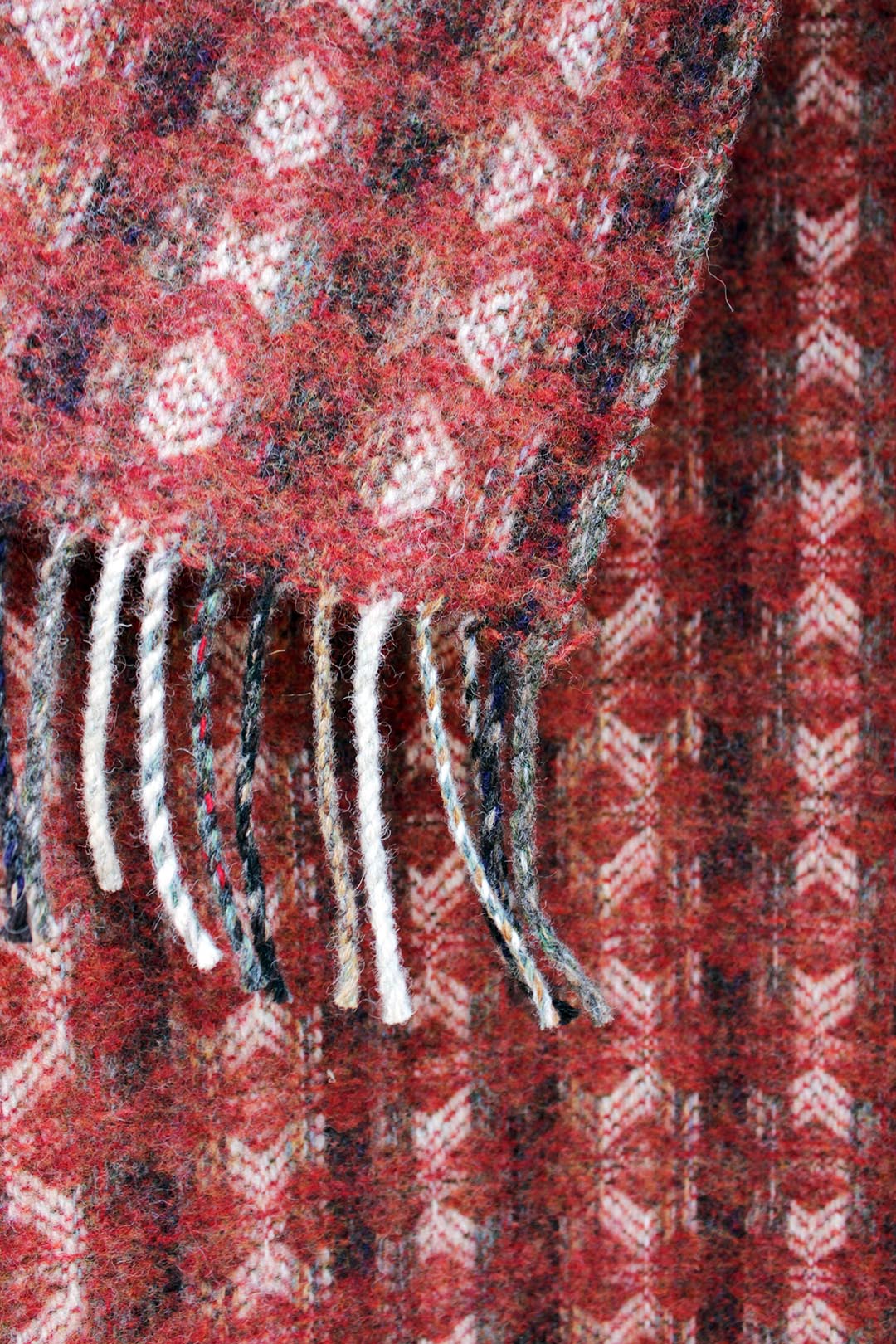 Sustainably woven Scottish wool tapestry throw or blanket in shades of red, Scottish Textiles Showcase