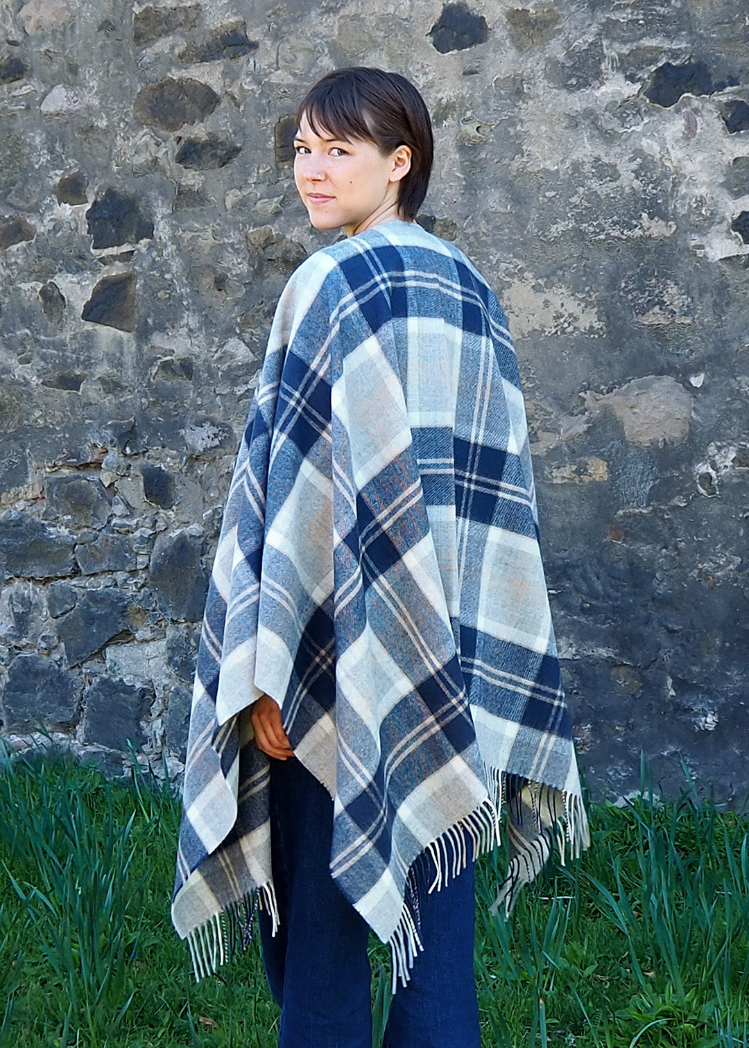 The muted tones in this Bannockbane Grey serape make it easy to wear over any outfit.