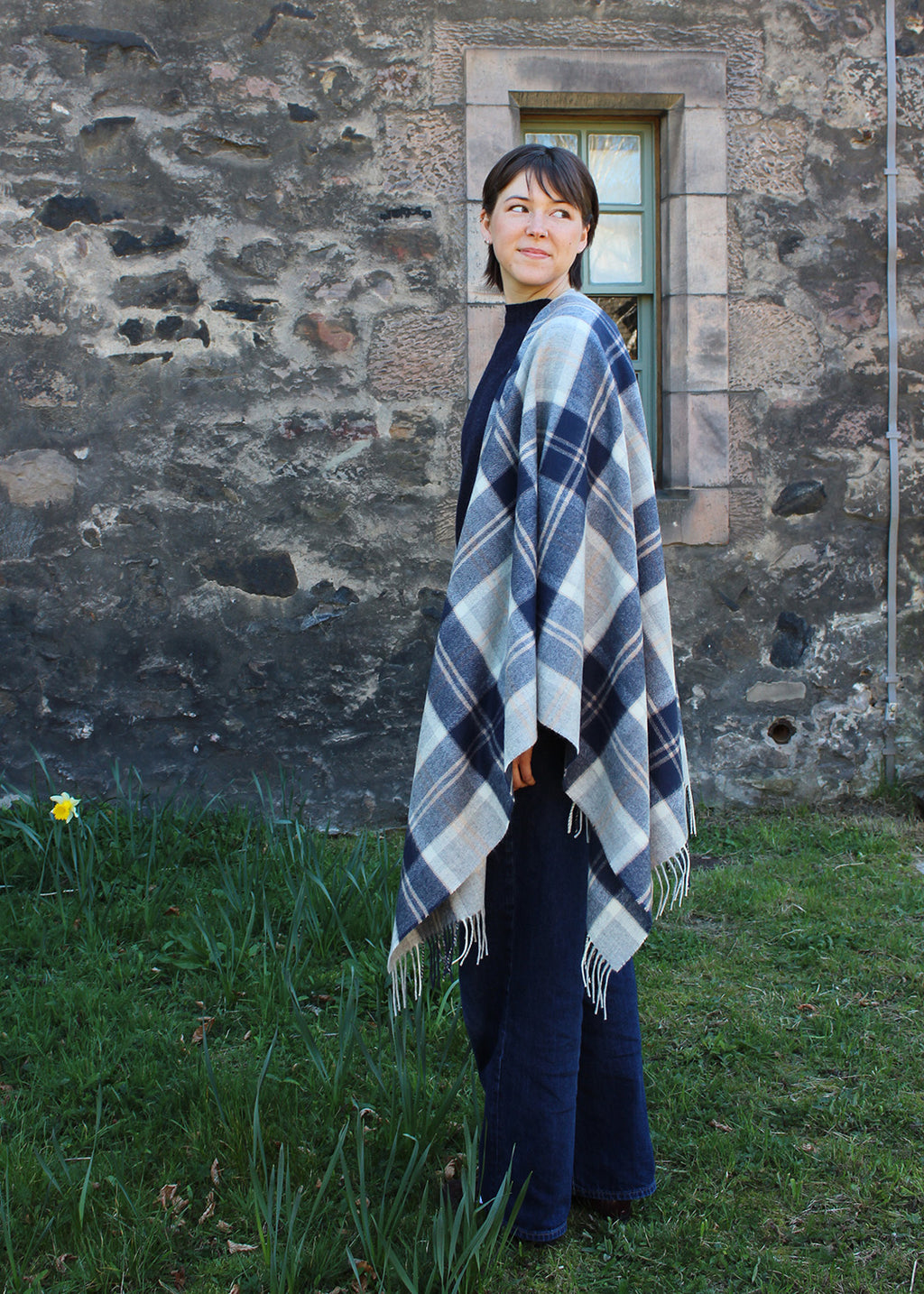 The muted tones in this Bannockbane Grey serape make it easy to wear over any outfit.