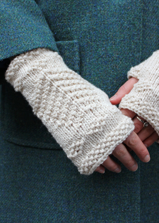 Hand knitted fingerless wristwarmers made in soft crowdie cream lambswool, with intricate tree of life motif.&nbsp;