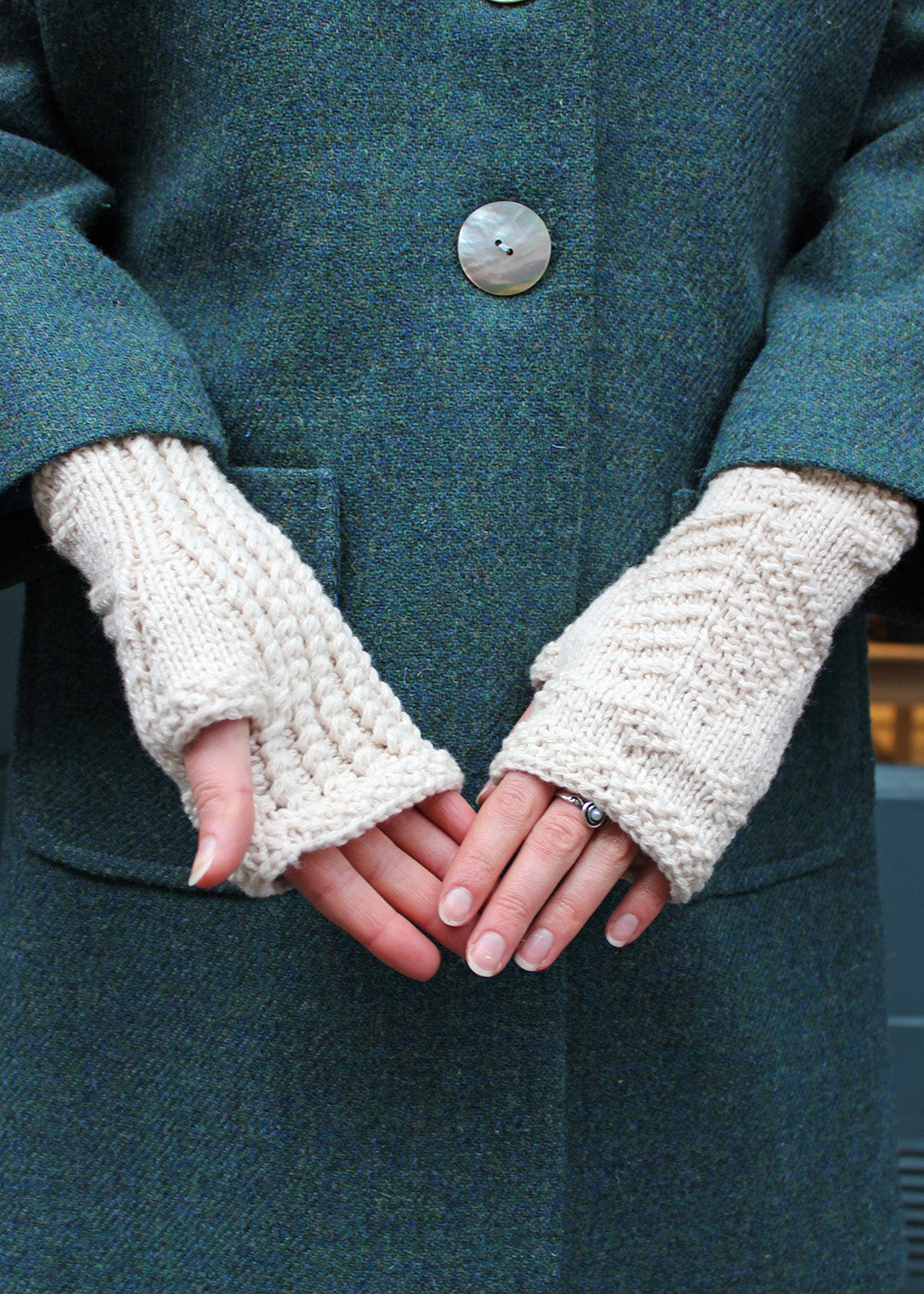 Hand knitted fingerless wristwarmers made in soft crowdie cream lambswool, with intricate tree of life motif.&nbsp;