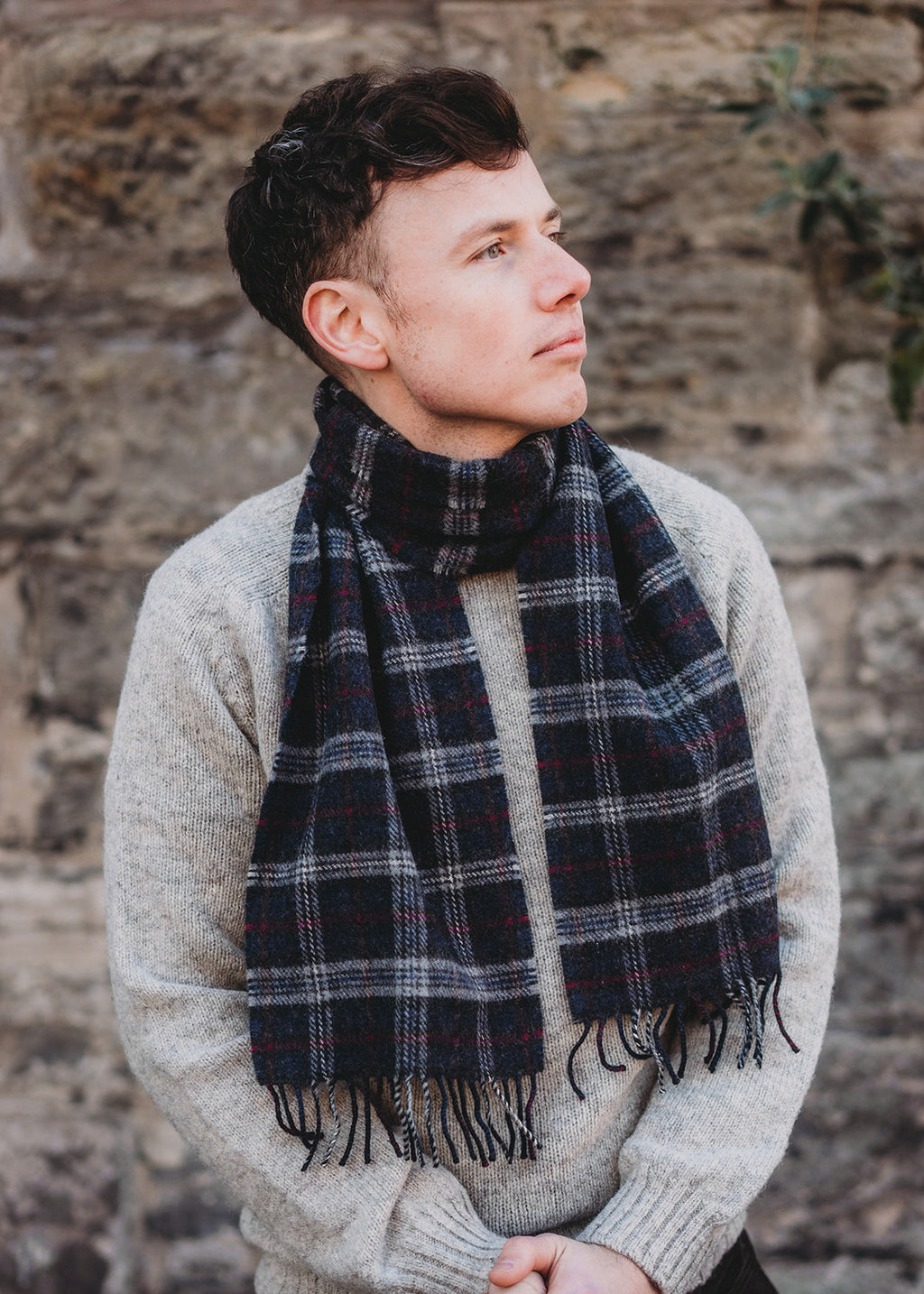 The Warrior Poet scarf is woven in soft, brushed lambswool with a classic check in colours inspired by the Scottish landscape.