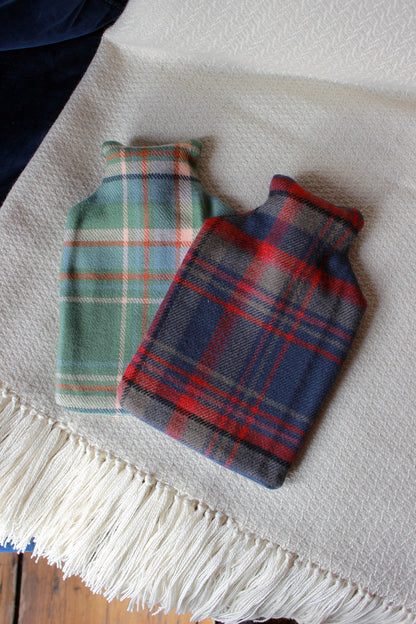 Snuggle up with our limited edition Araminta Campbell Highlands at Dawn tartan hot water bottle