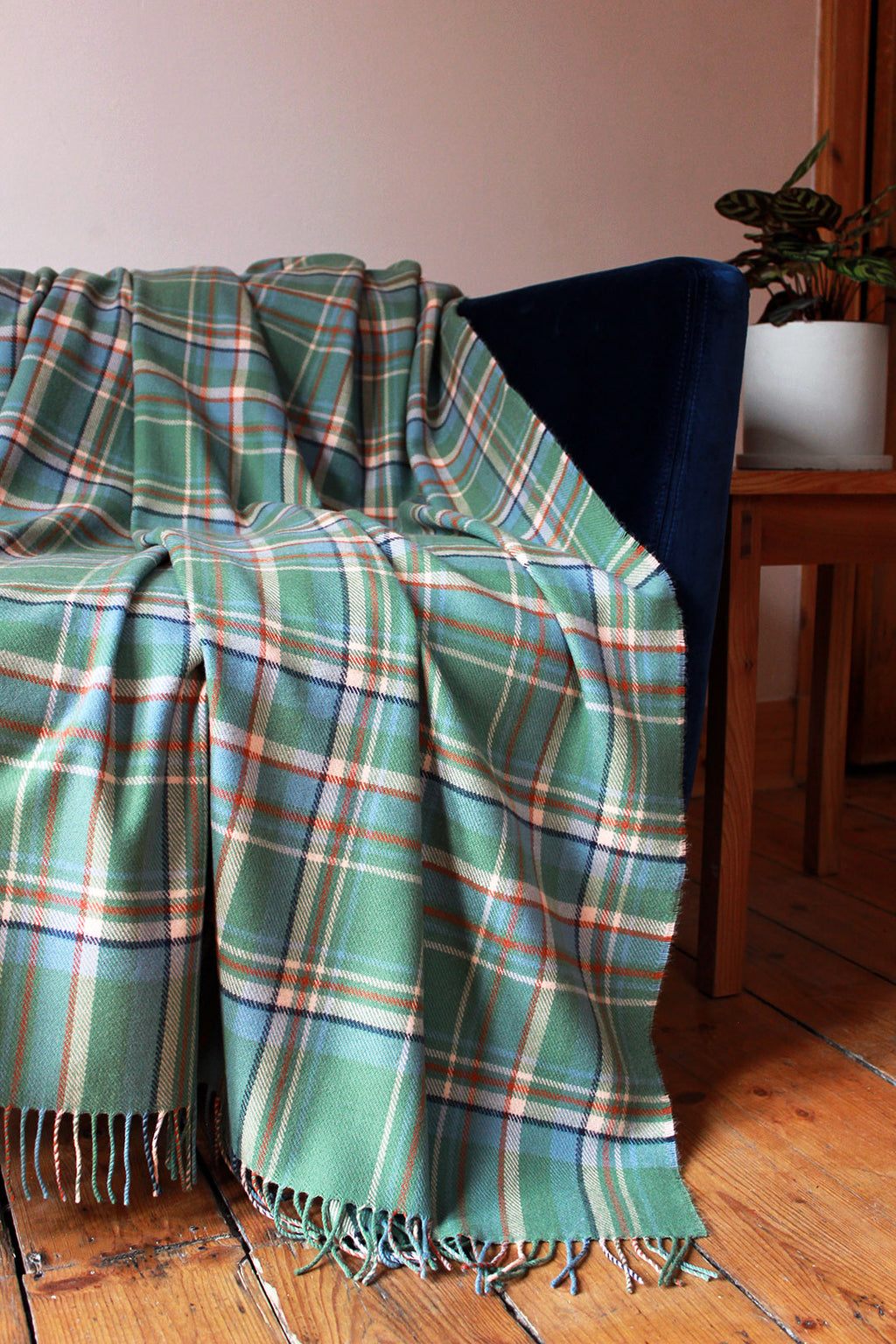 Limited edition Highlands at Dawn lambswool blanket features an original plaid design by Araminta Campbell