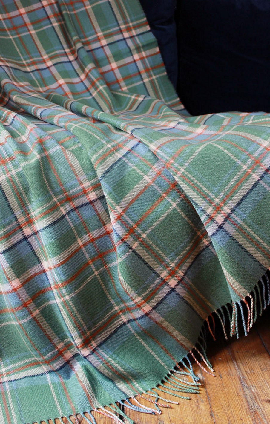 Limited edition Highlands at Dawn lambswool blanket features an original plaid design by Araminta Campbell