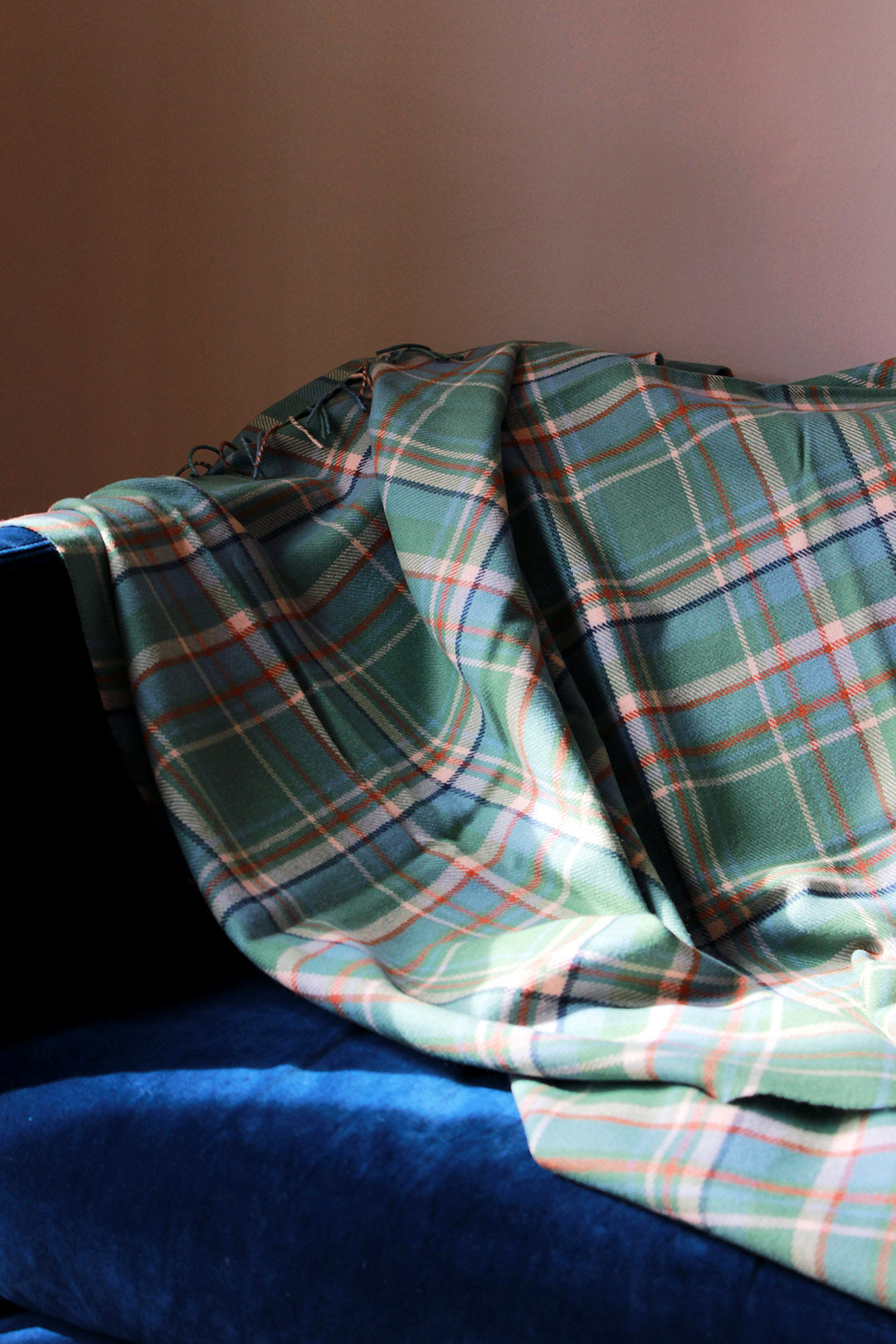 Limited edition Highlands at Dawn lambswool blanket features an original plaid design by Araminta Campbell