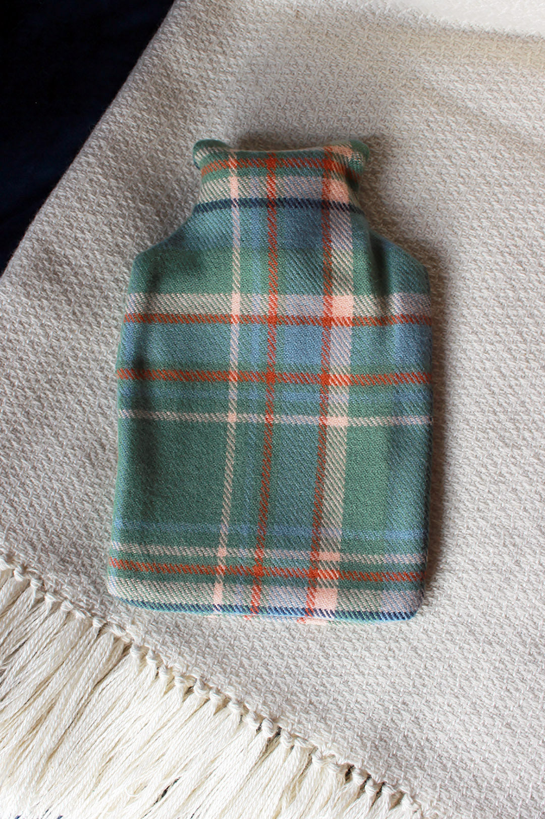 Snuggle up with our limited edition Araminta Campbell Highlands at Dawn tartan hot water bottle