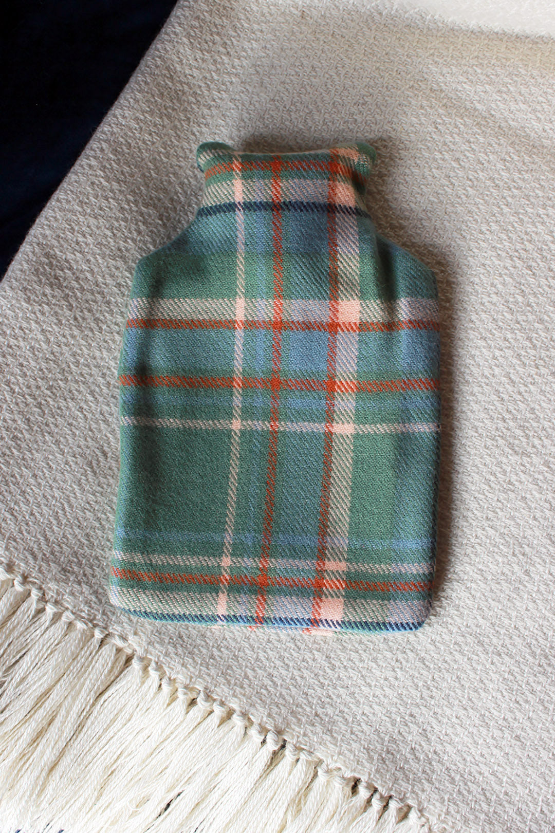 Snuggle up with our limited edition Araminta Campbell Highlands at Dawn tartan hot water bottle