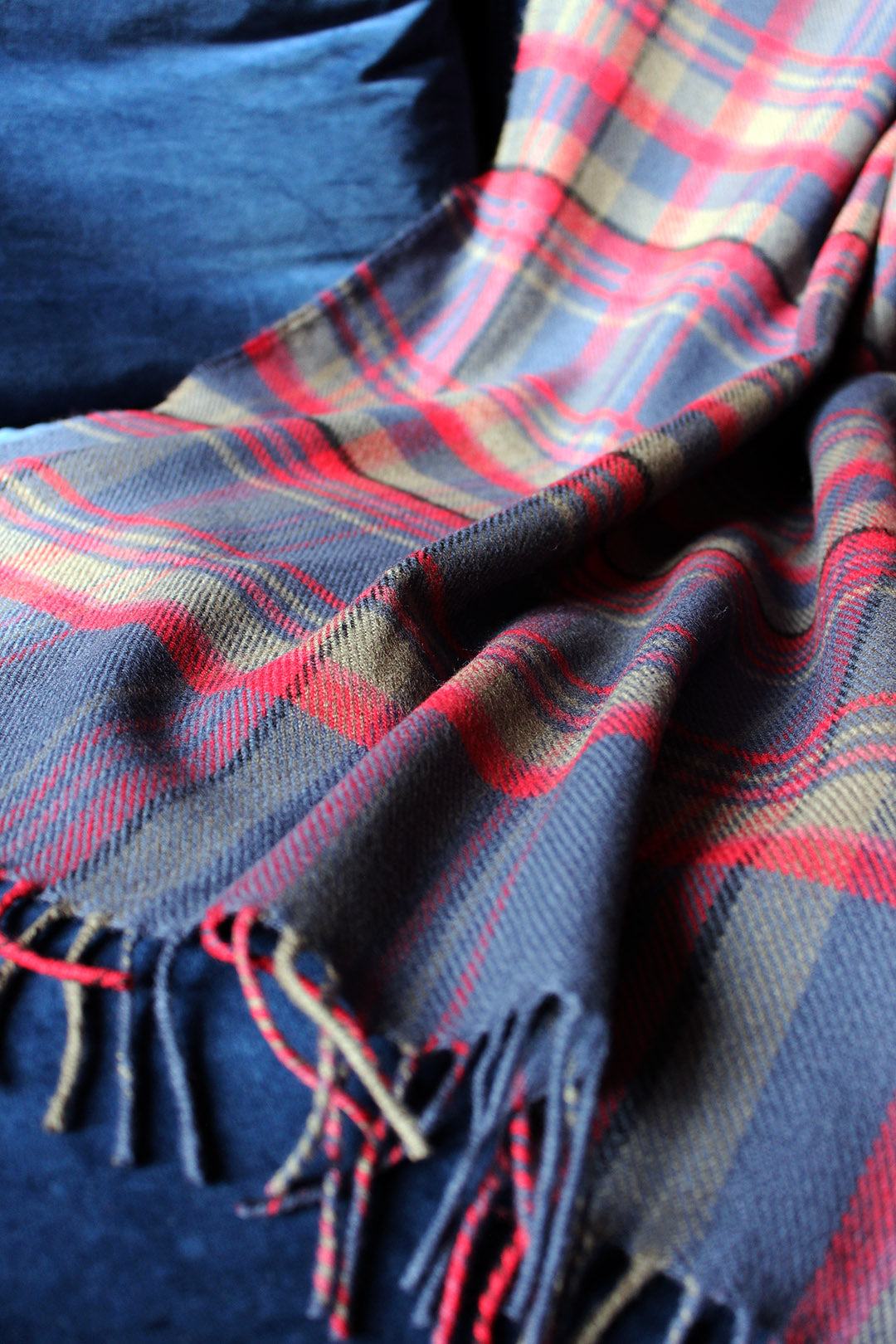 Limited edition Highlands at dusk lambswool blanket features an original plaid design by Araminta Campbell