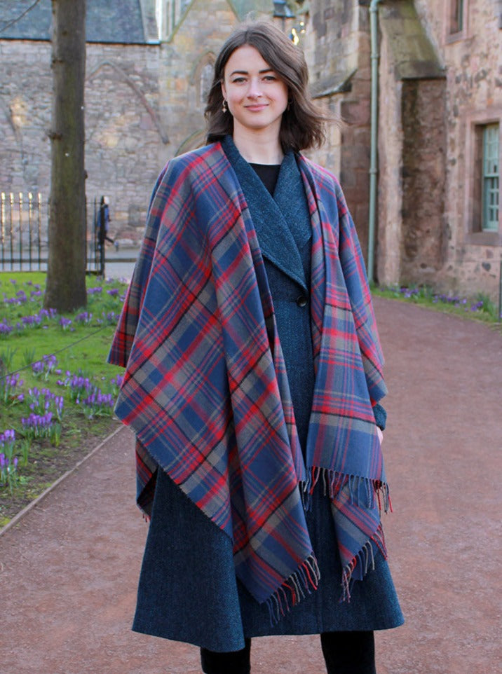 Araminta Campebell Highlands at Dusk woven lambswool serape with tassels. Woven with muted dusky blue, grey and sunset red. Scottish Textiles Showcase.
