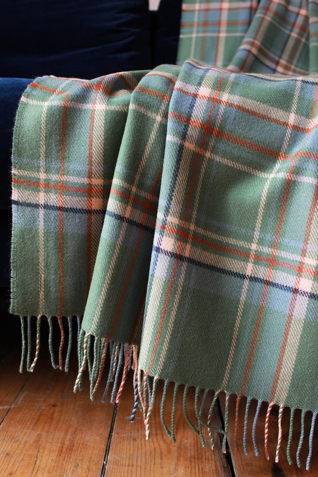Limited edition Highlands at Dawn lambswool blanket features an original plaid design by Araminta Campbell