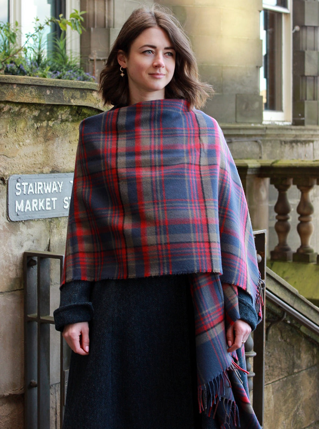 Araminta Campebell Highlands at Dusk woven lambswool serape with tassels. Woven with muted dusky blue, grey and sunset red. Scottish Textiles Showcase.