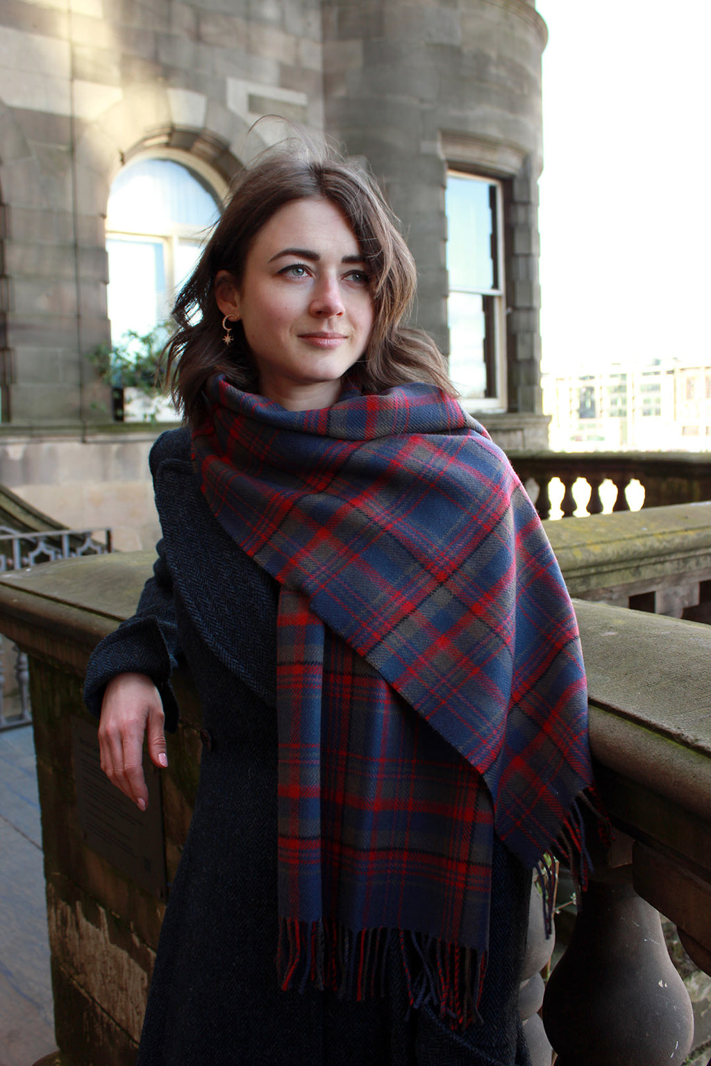 Araminta Campebell Highlands at Dusk woven lambswool shawl with tassels. Woven with muted dusky blue, grey and sunset red. Scottish Textiles Showcase.