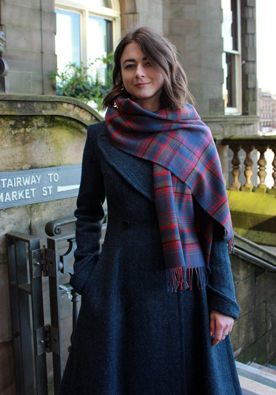 Araminta Campebell Highlands at Dusk woven lambswool shawl with tassels. Woven with muted dusky blue, grey and sunset red. Scottish Textiles Showcase.