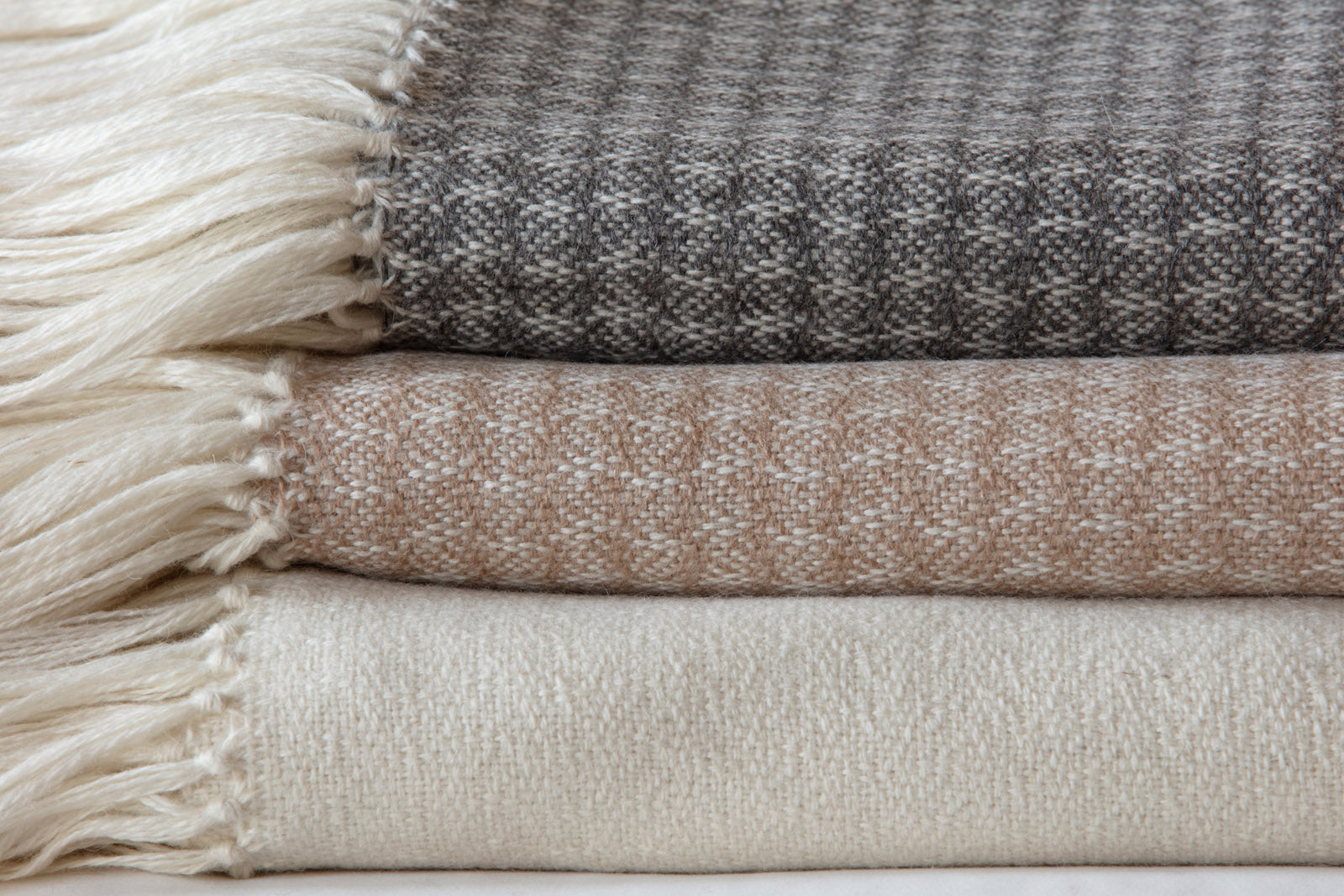 Araminta Campbell alpaca willow throws in caramel grey and white at Scottish Textiles Showcase