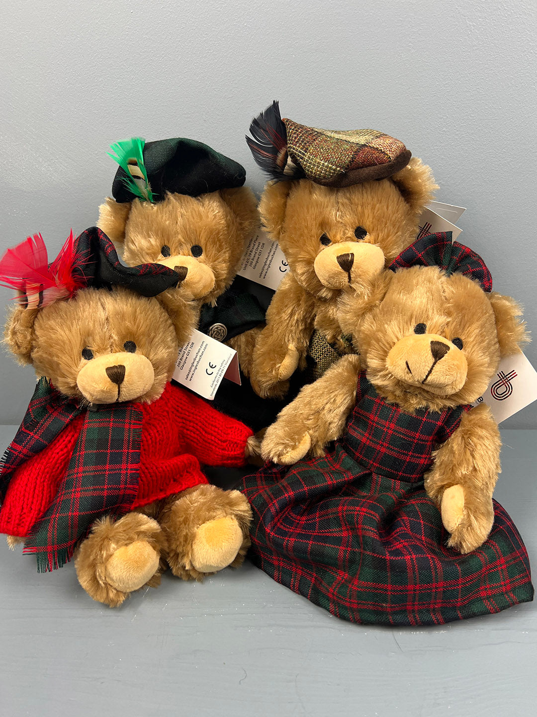 Group of teddy bears wearing traditional Scottish Tartan