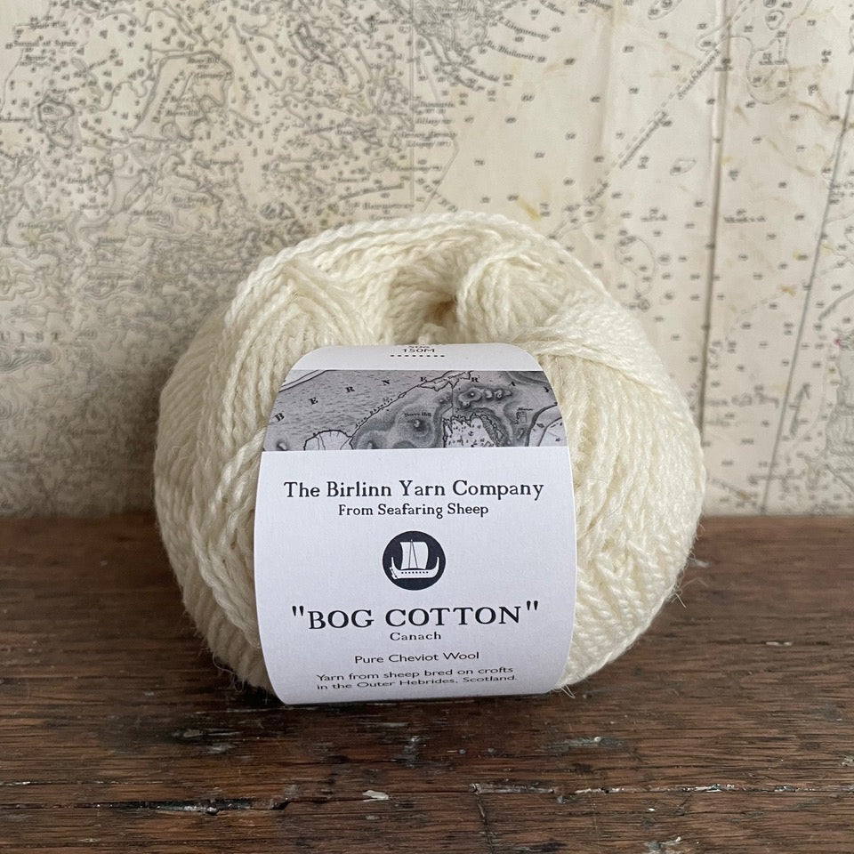 Ball of 4 ply finger weight cream white Bog Cotton yarn from Cheviot sheep in North Uist. Scottish Textiles Showcase.