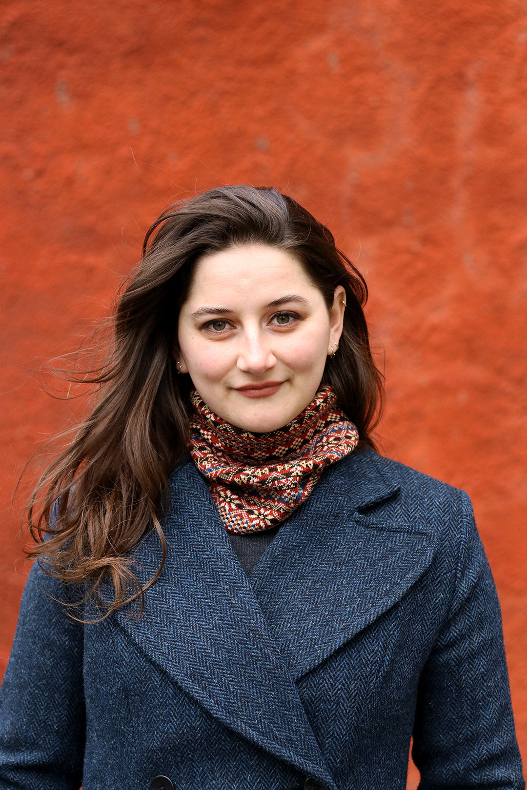 Navy blue and black herringbone Harris Tweed ladies coat shown on model.