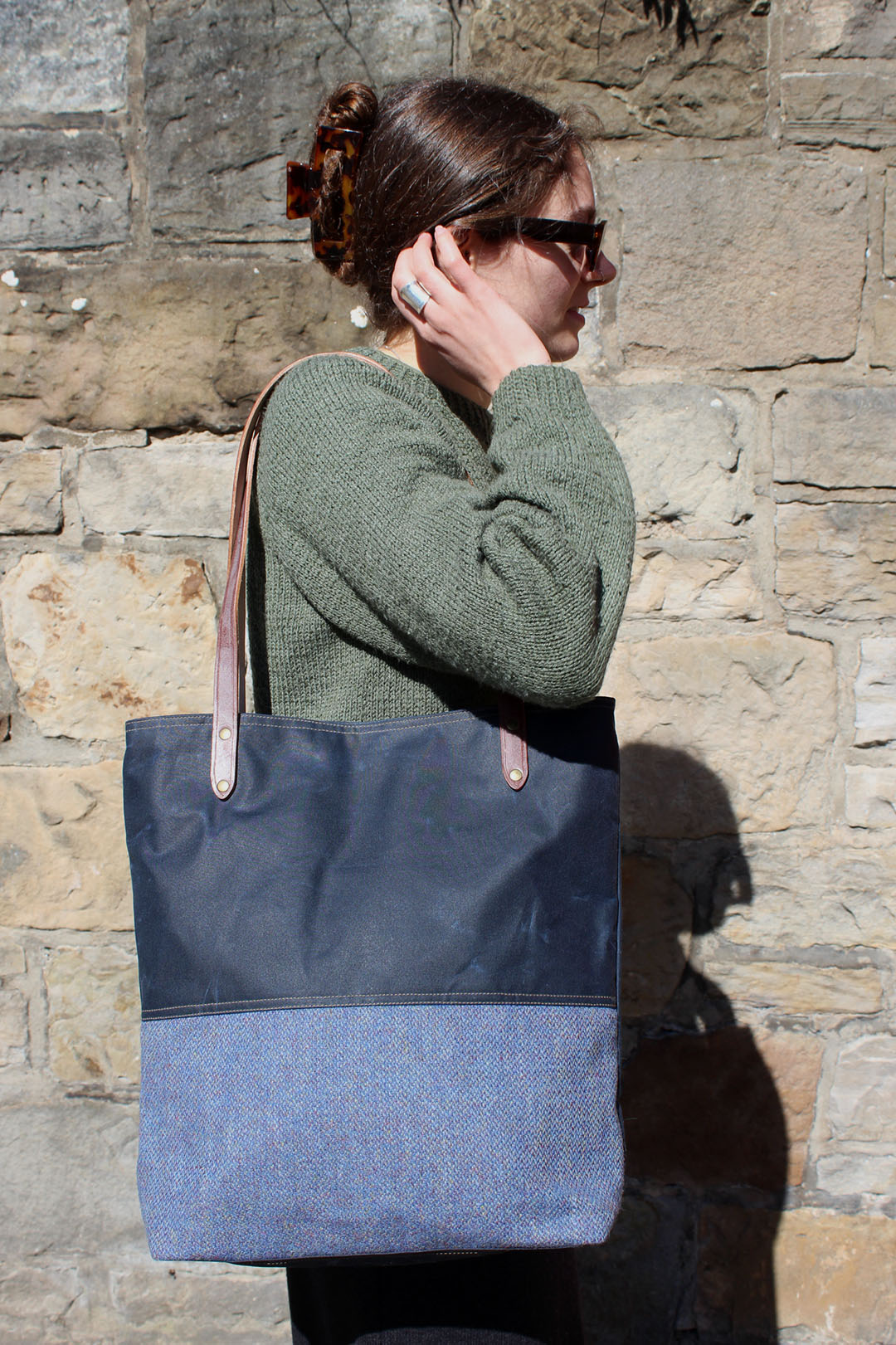 Scottish Textiles Showcase and Fernweh tote bag collaboration in waxed cotton and Harris Tweed. Sky blue with brown leather straps.