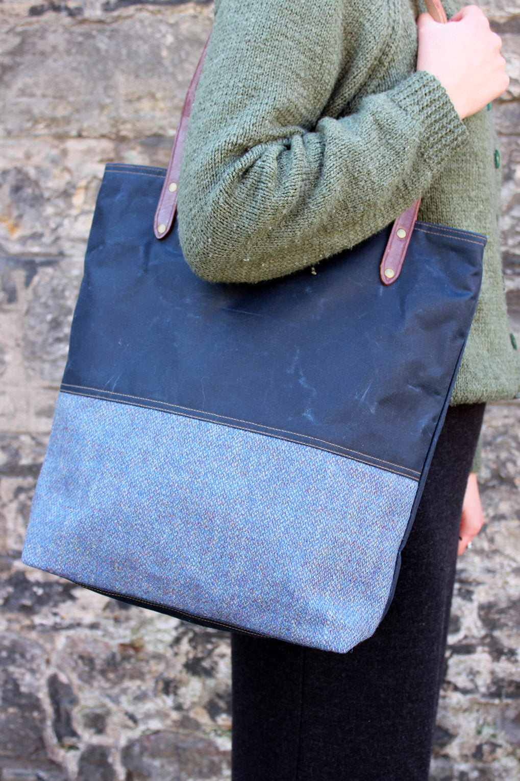 Scottish Textiles Showcase and Fernweh tote bag collaboration in waxed cotton and Harris Tweed. Sky blue with brown leather straps.