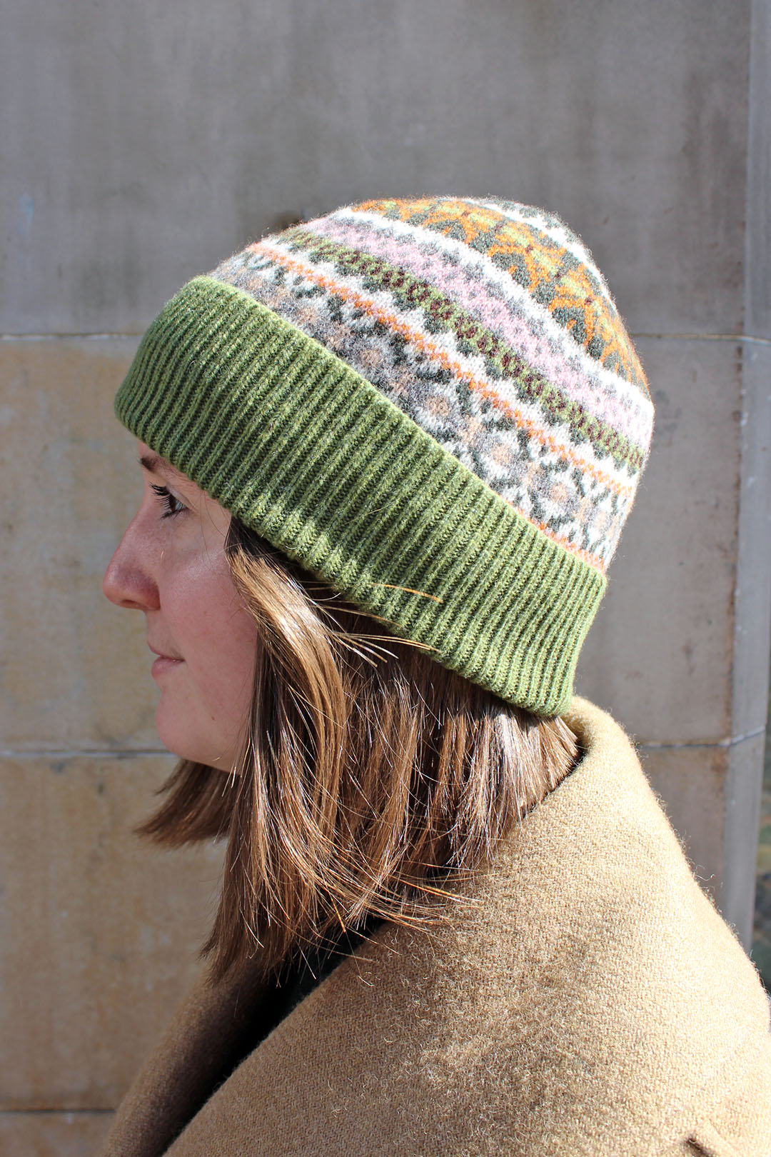 Fairisle wool hat in moss with pink and cream pattern