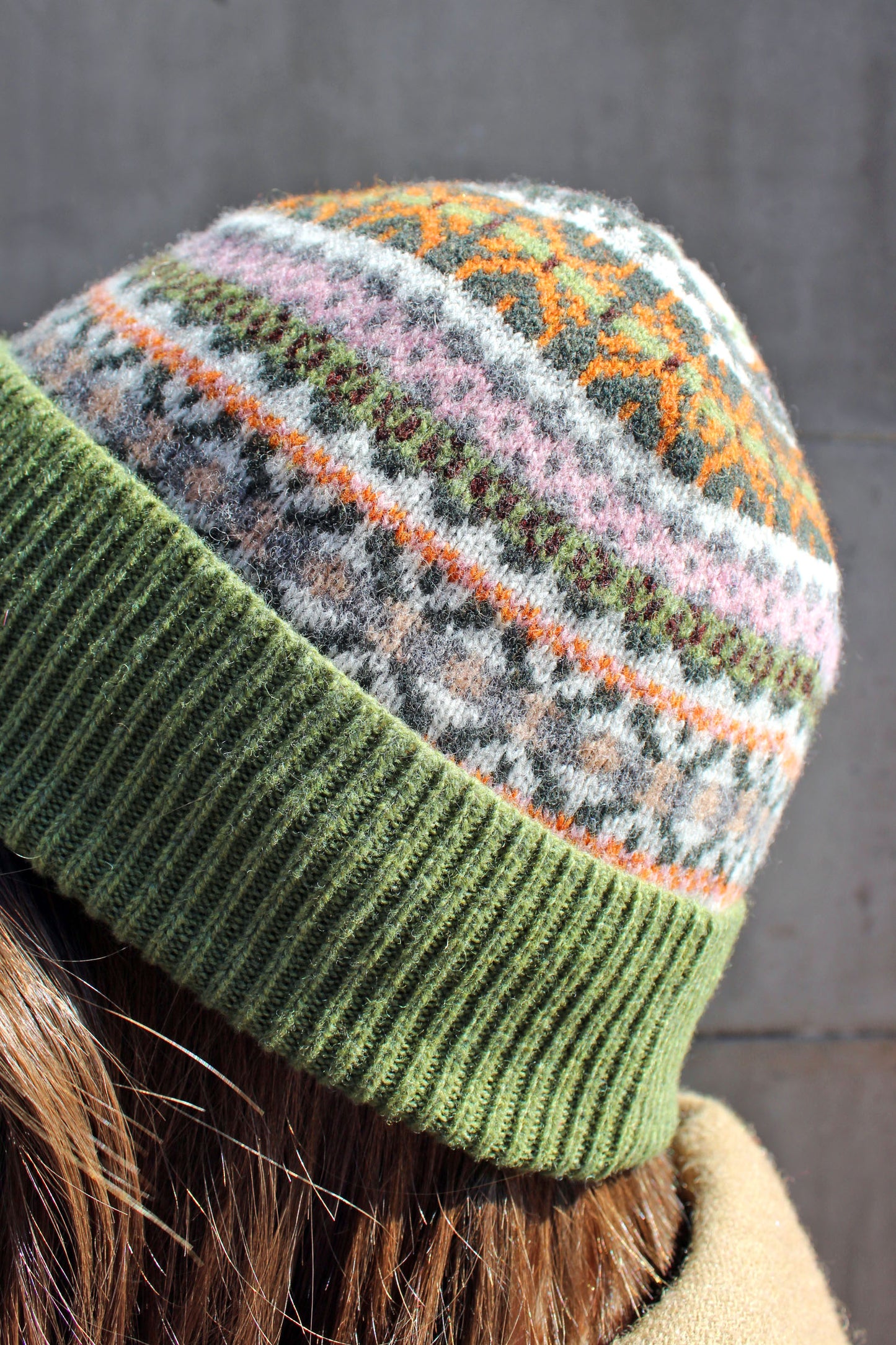 Fairisle wool hat in moss with pink and cream pattern
