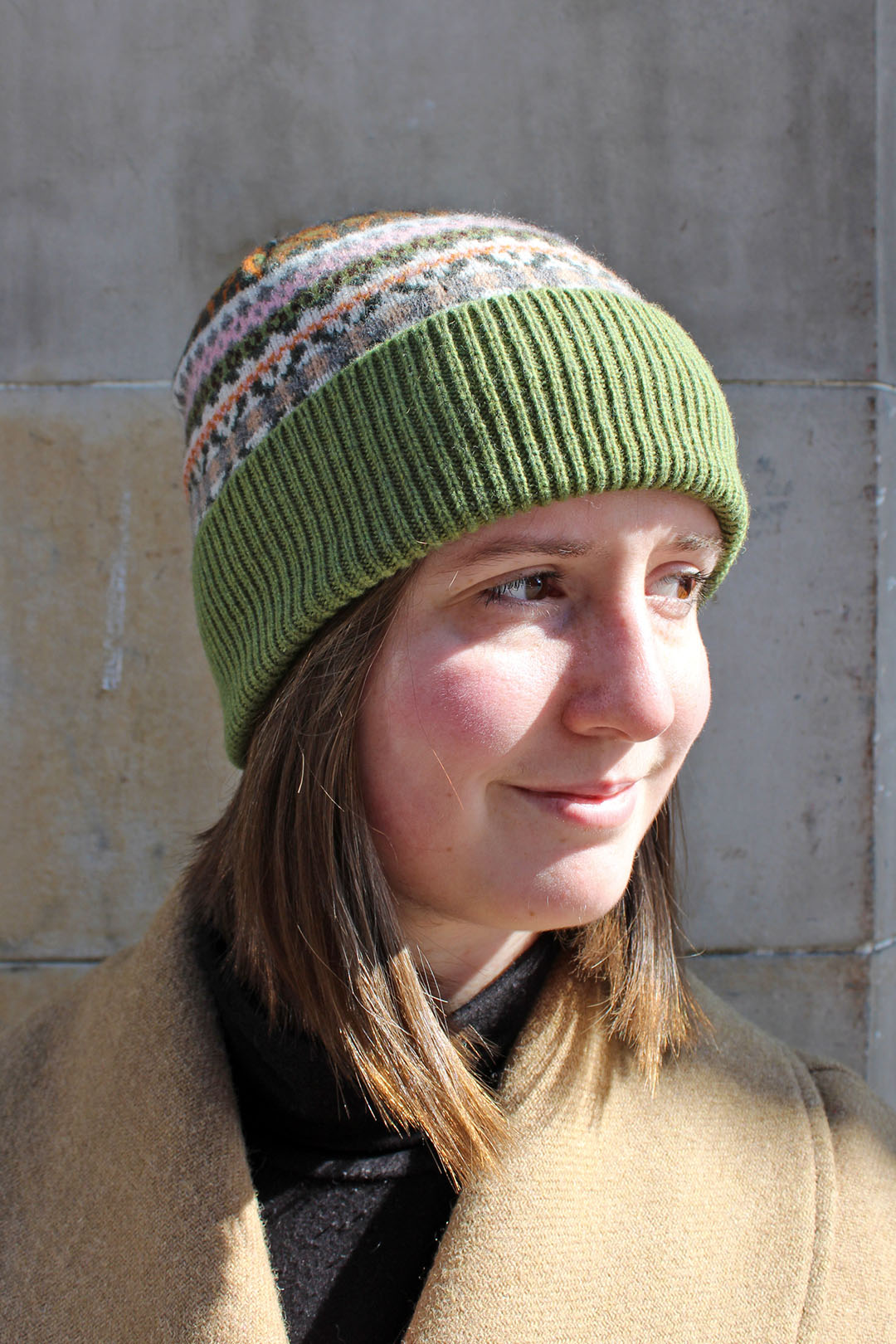 Fairisle wool hat in moss with pink and cream pattern