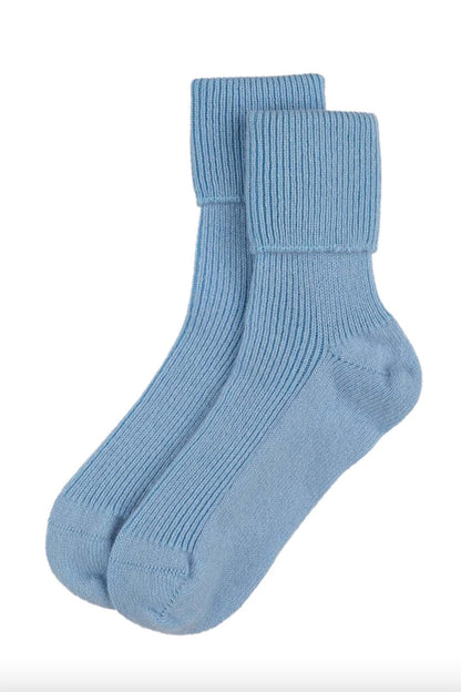 Cashmere bed socks knitted in Scottish Borders in powder blue colour. Scottish Textiles Showcase.