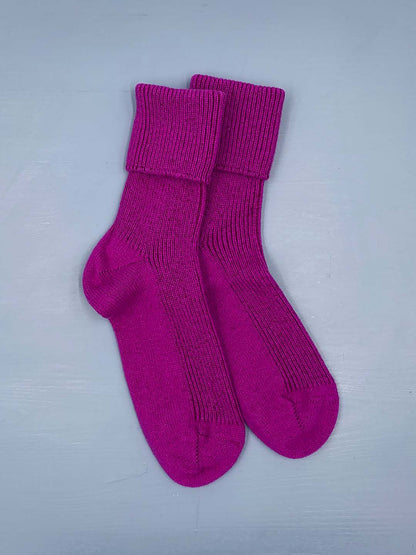 Cashmere bed socks in a vibrant fuchsia pink shade designed and made in Scotland