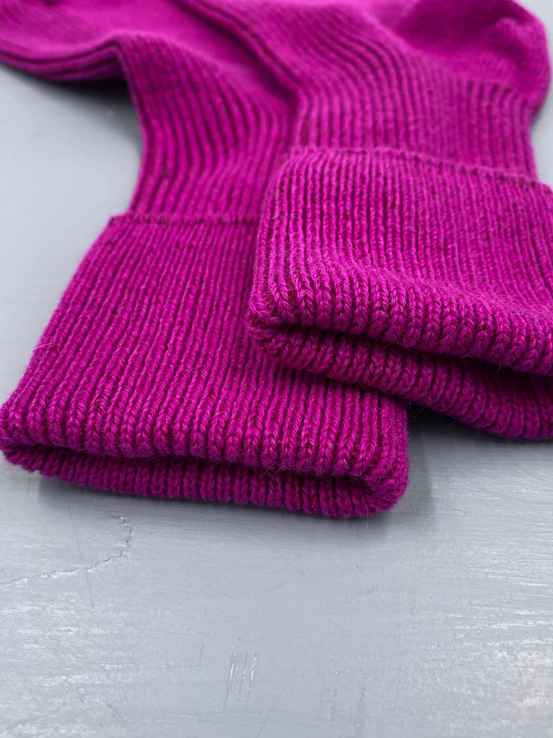 Cashmere bed socks in a vibrant fuchsia pink shade designed and made in Scotland